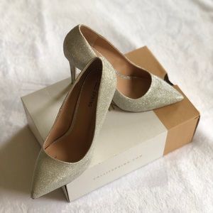 Call it spring silver glittery pointy pumps